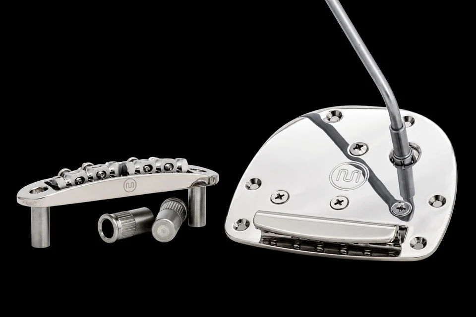 Mastery M1 bridge and OMV vibrato on a black background